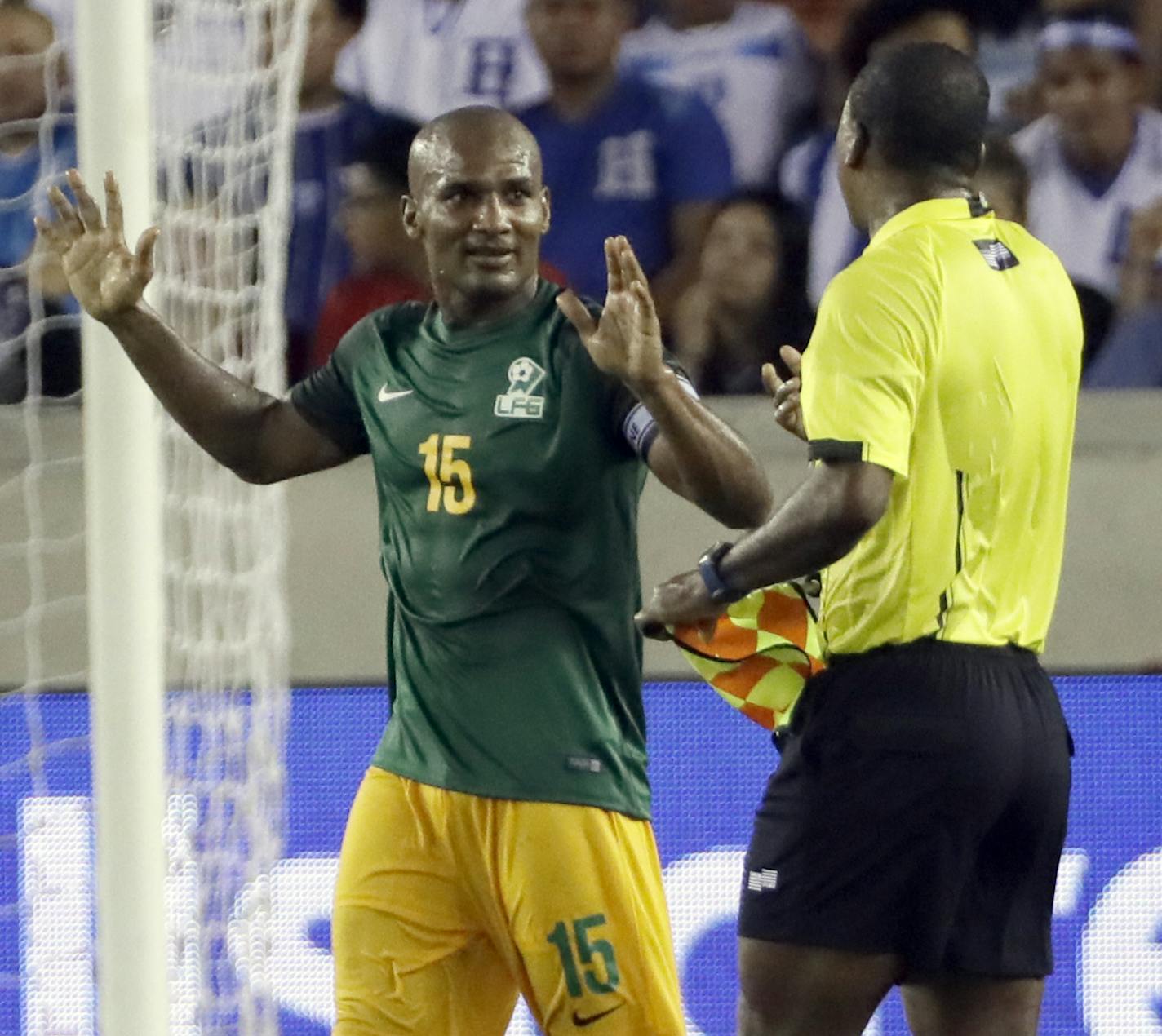 French Guiana midfielder Florent Malouda (15) talks with a linesman at halftime during a CONCACAF Gold Cup soccer match against Honduras on Tuesday, July 11, 2017, in Houston. (AP Photo/David J. Phillip) ORG XMIT: TXDP101