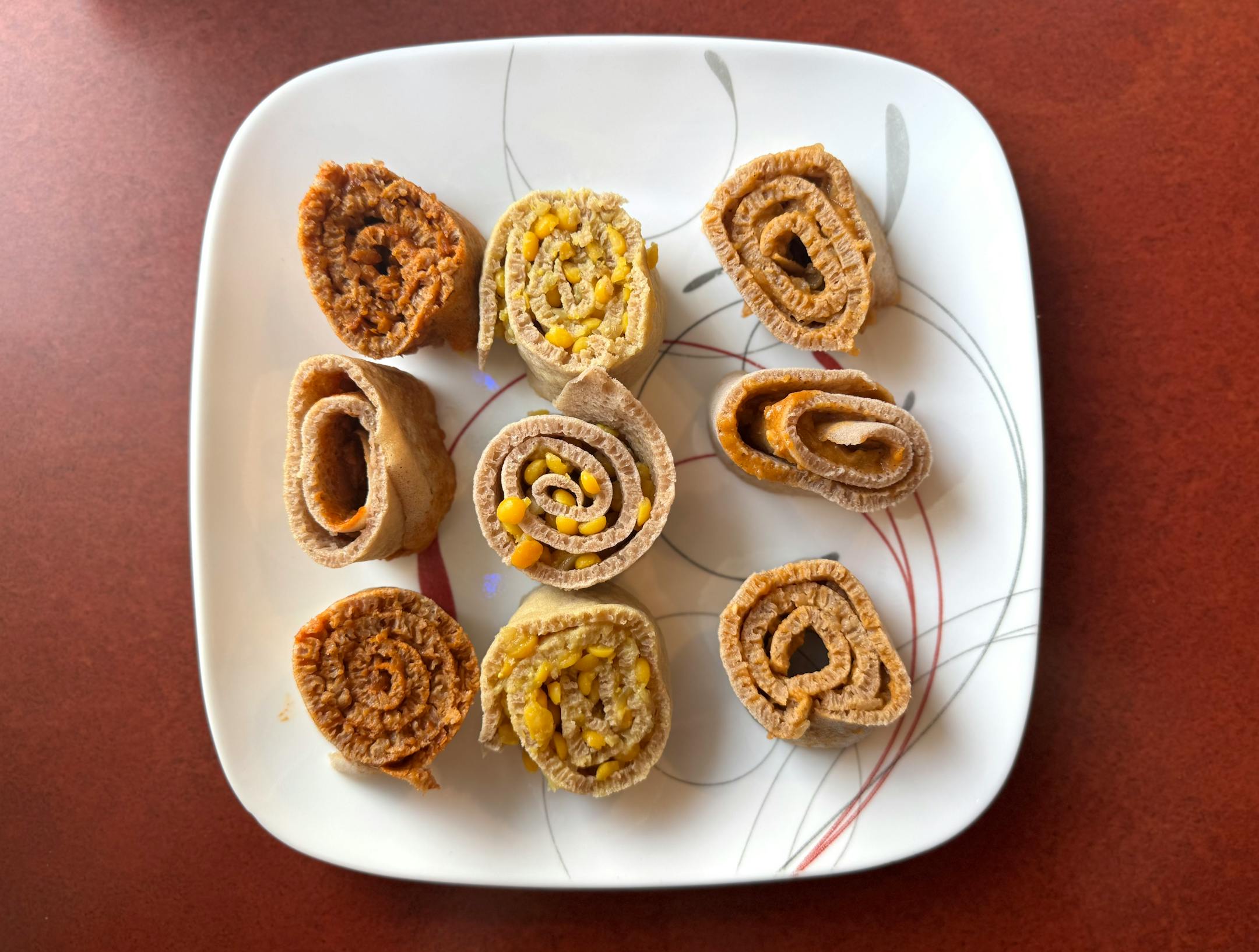 Injera roll sampler with spiced red lentils in berbere spice, yellow chickpea stew and red split pea stew from Blue Nile Ethiopian Restaurant in North St. Paul.