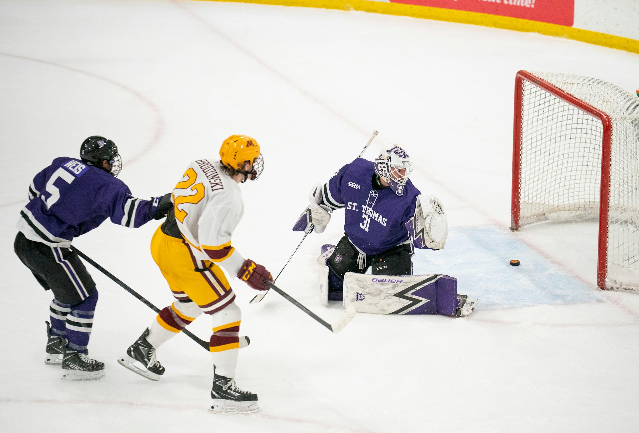 Tommies goaltender Jacob Berger (31) looks back at the puck Gophers forward Bryce Brodzinski (22) put in his net in the first period Sunday afternoon, Jan. 2, 2022 at Doug Woog Arena in South St. Paul.