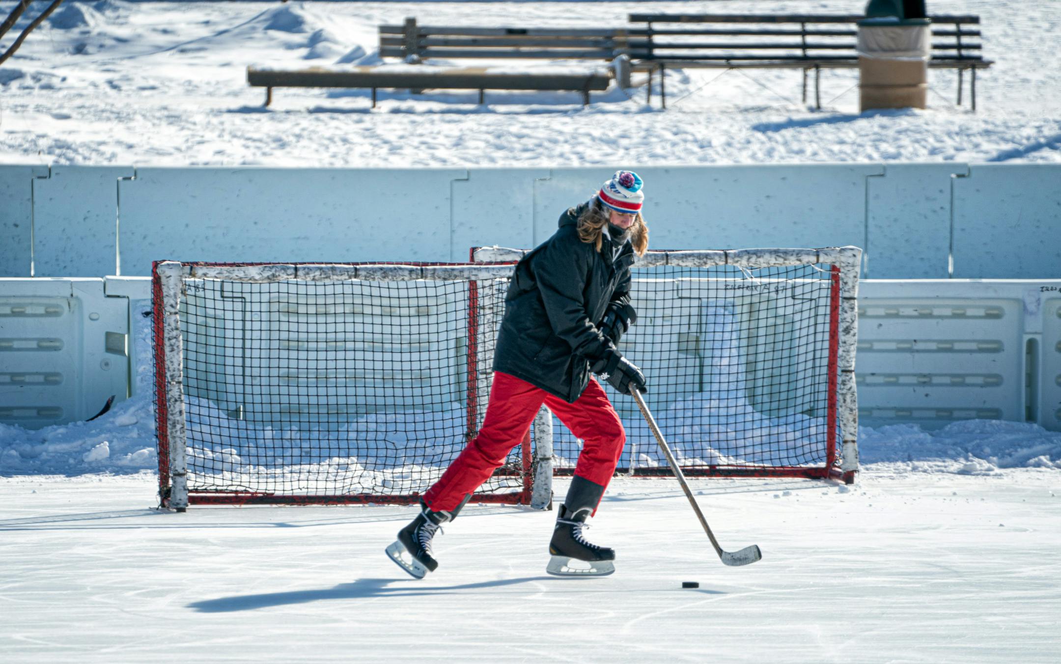 Dan Larson slapped pucks on Lake of the Isles Monday morning. Larson recently moved to Uptown Minneapolis from Brainerd. He had the ice all to himself Monday as the temperature read 8 below zero.