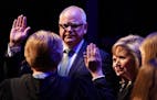 Gov. Tim Walz stood with his family as he took the oath of office at the Fitzgerald Theater in St. Paul, Minn. ] ANTHONY SOUFFLE &#x2022; anthony.souf