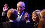 Gov. Tim Walz stood with his family as he took the oath of office at the Fitzgerald Theater in St. Paul, Minn. ] ANTHONY SOUFFLE &#x2022; anthony.souf