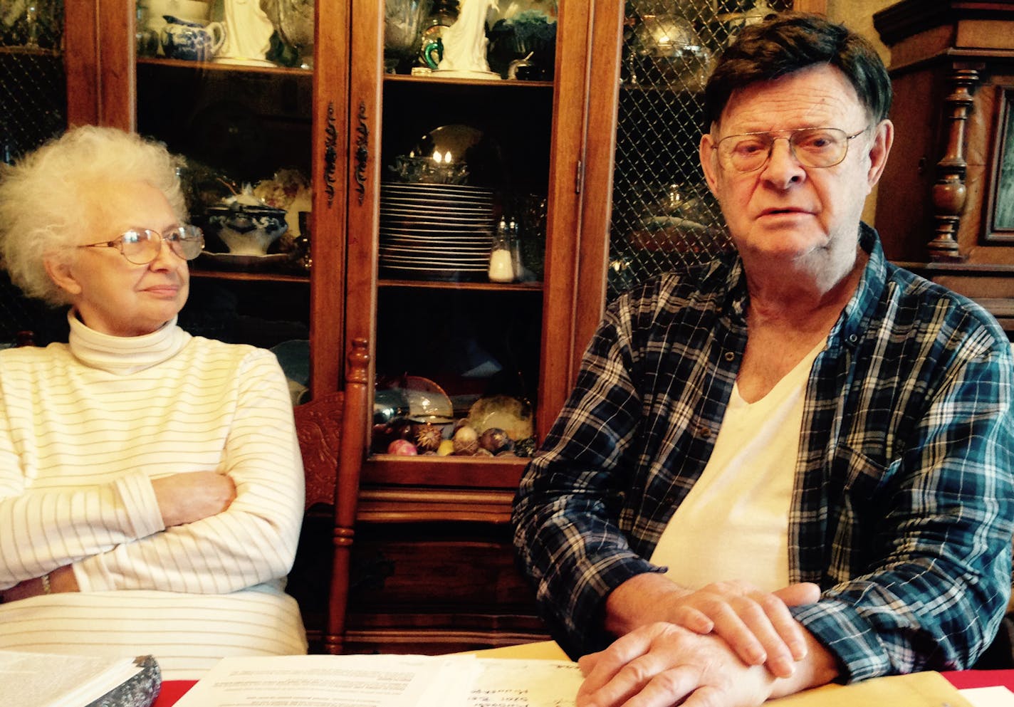 Andrew Ellis and his wife, Harriet, sitting at a table in their south Minneapolis house. Ellis is looking at orders for repairs for alleged violations on one of his south Minneapolis properties. Ellis calls many of the allegations &#x201a;&#xc4;&#xfa;bogus.&#x201a;&#xc4;&#xf9; He calls the city inspections office &#x201a;&#xc4;&#xfa;incompetent&#x201a;&#xc4;&#xf9; and says &#x201a;&#xc4;&#xfa;they are harassing the hell out of me.&#x201a;&#xc4;&#xf9; Ellis, with his wife, have sued the city in f