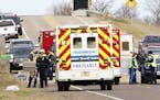 Emergency medical personnel gather at the scene of a hit-and-run accident Saturday, Nov. 3, 2018, in Lake Hallie, Wis., that killed three girls and an