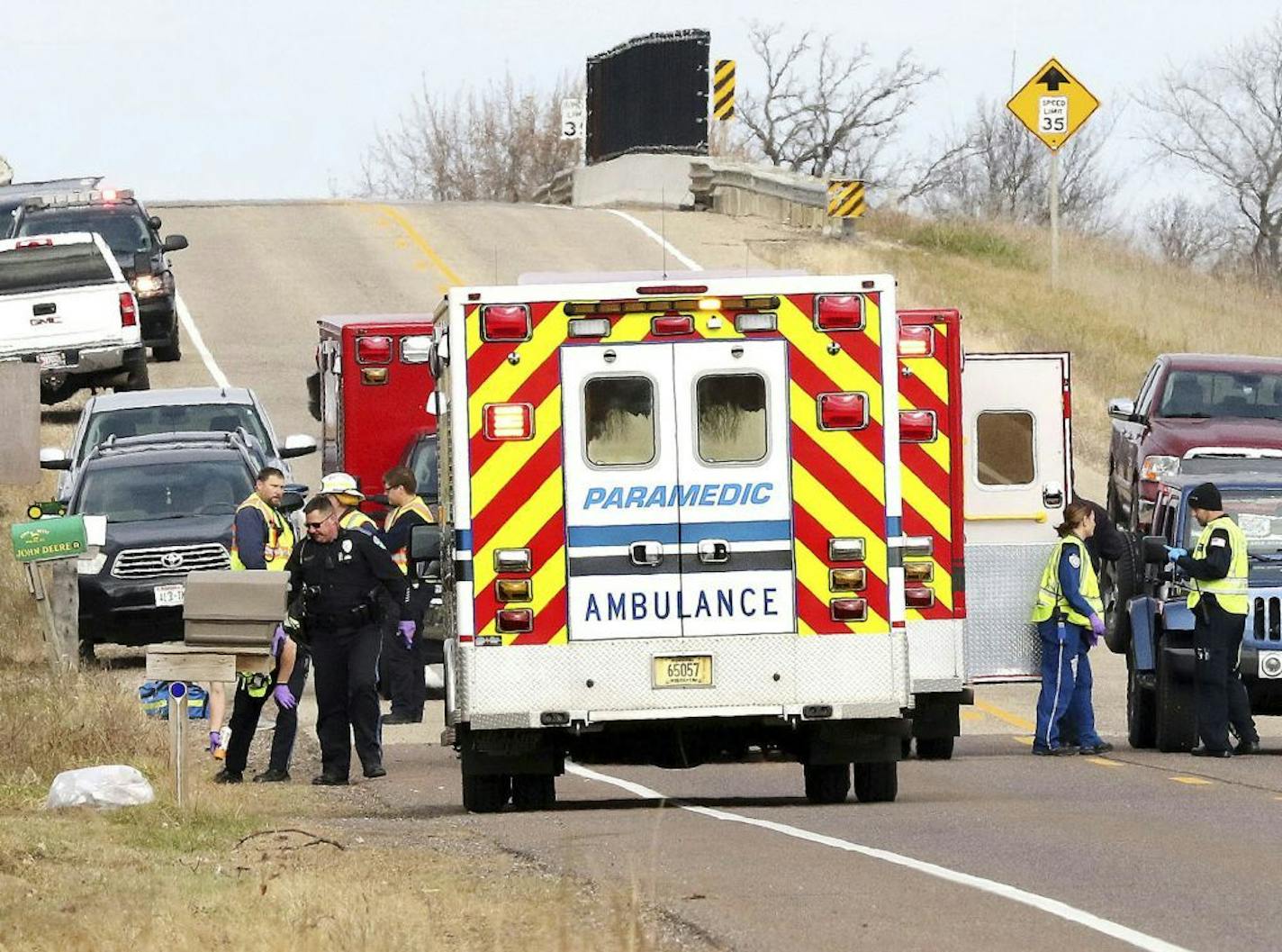 Emergency medical personnel gather at the scene of a hit-and-run accident Saturday, Nov. 3, 2018, in Lake Hallie, Wis., that killed three girls and an adult.