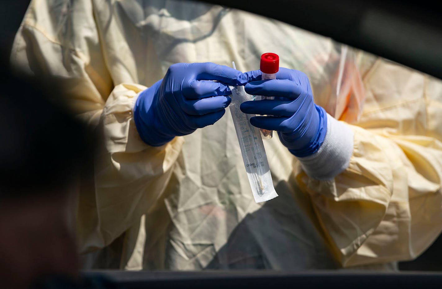 Medical Assistant Courtney Banks prepared to administer a COVID-19 test at their drive up testing site in front of St. Luke's Miller Creek Medical Clinic in Duluth on April 27, 2020.