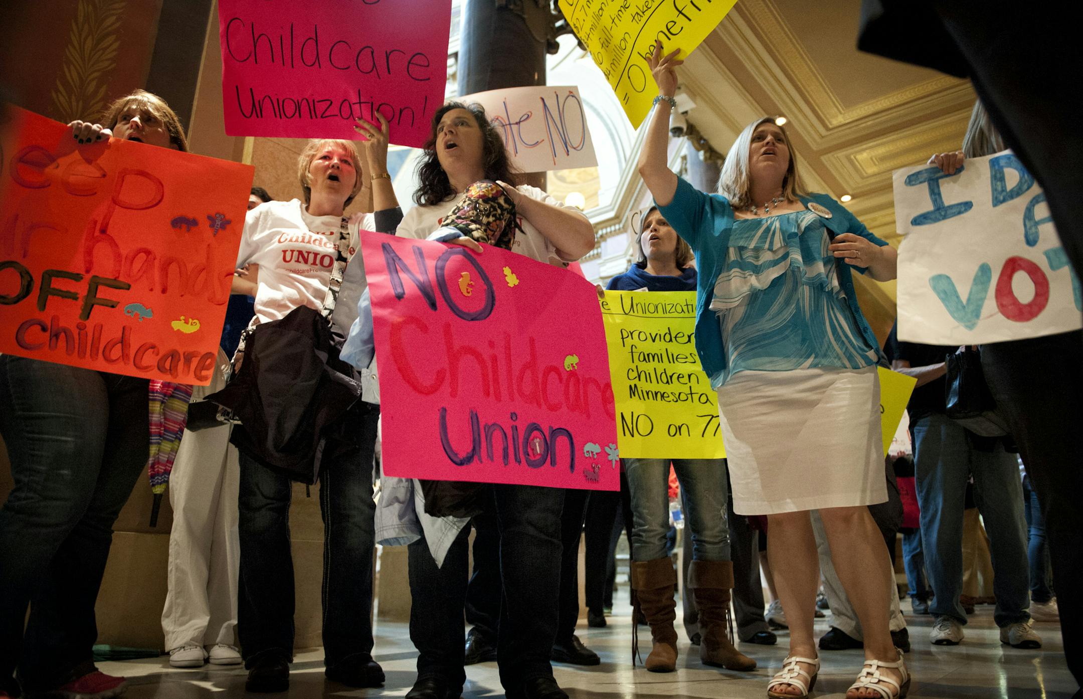 Daycare providers cheering Vote No outside the House Chamber. Vote Yes and Vote No echoed in throughout the Capitol Saturday, May 18, 2013 as legislators were set to debate the childcare unionization bill. ] GLEN STUBBE * gstubbe@startribune.com