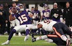 Minnesota Vikings quarterback Joshua Dobbs (15) gets rid of the ball as he's brought down in the second quarter of a NFL game between the Minnesota Vi
