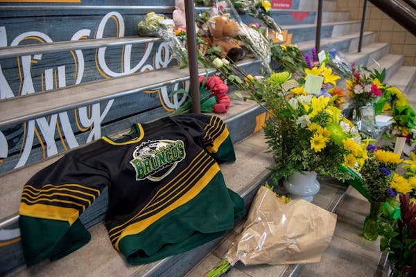 A memorial at the stairs that lead to Elgar Petersen Arena is shown in Humboldt, Saskatchewan, on Saturday