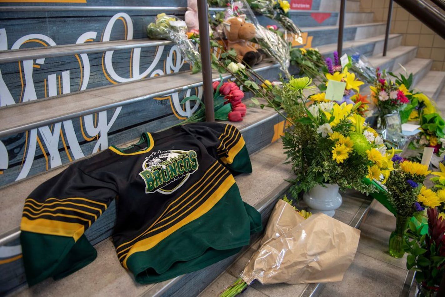 A memorial at the stairs that lead to Elgar Petersen Arena is shown in Humboldt, Saskatchewan, on Saturday