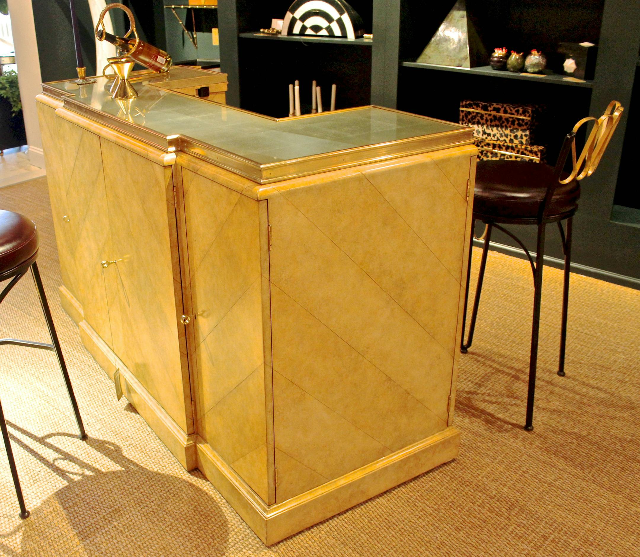 SH13G036HOMEBARS July 8, 2013 -- A parchment lacquered leather inlaid bar with silver eglomise top and satina brass accents by Celerie Kemble for Maitland-Smith. (SHNS photo by Patricia Sheridan/Pittsburgh Post-Gazette) (Newscom TagID: shnsphotos147083.jpg) [Photo via Newscom]