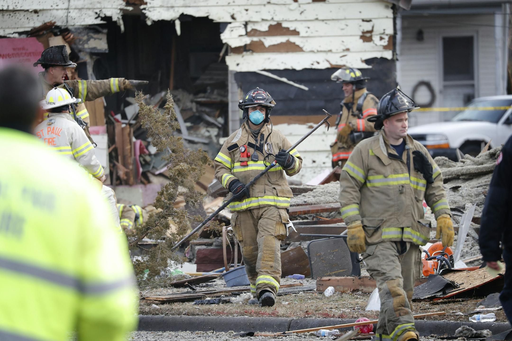 St. Paul firefighters at the scene of an explosion at the 600 block of Payne Avenue in St. Paul on Friday, November 23, 2018. One man was taken to a local hospital with injuries and his status is unknown. Eight people were displaced by the explosion.