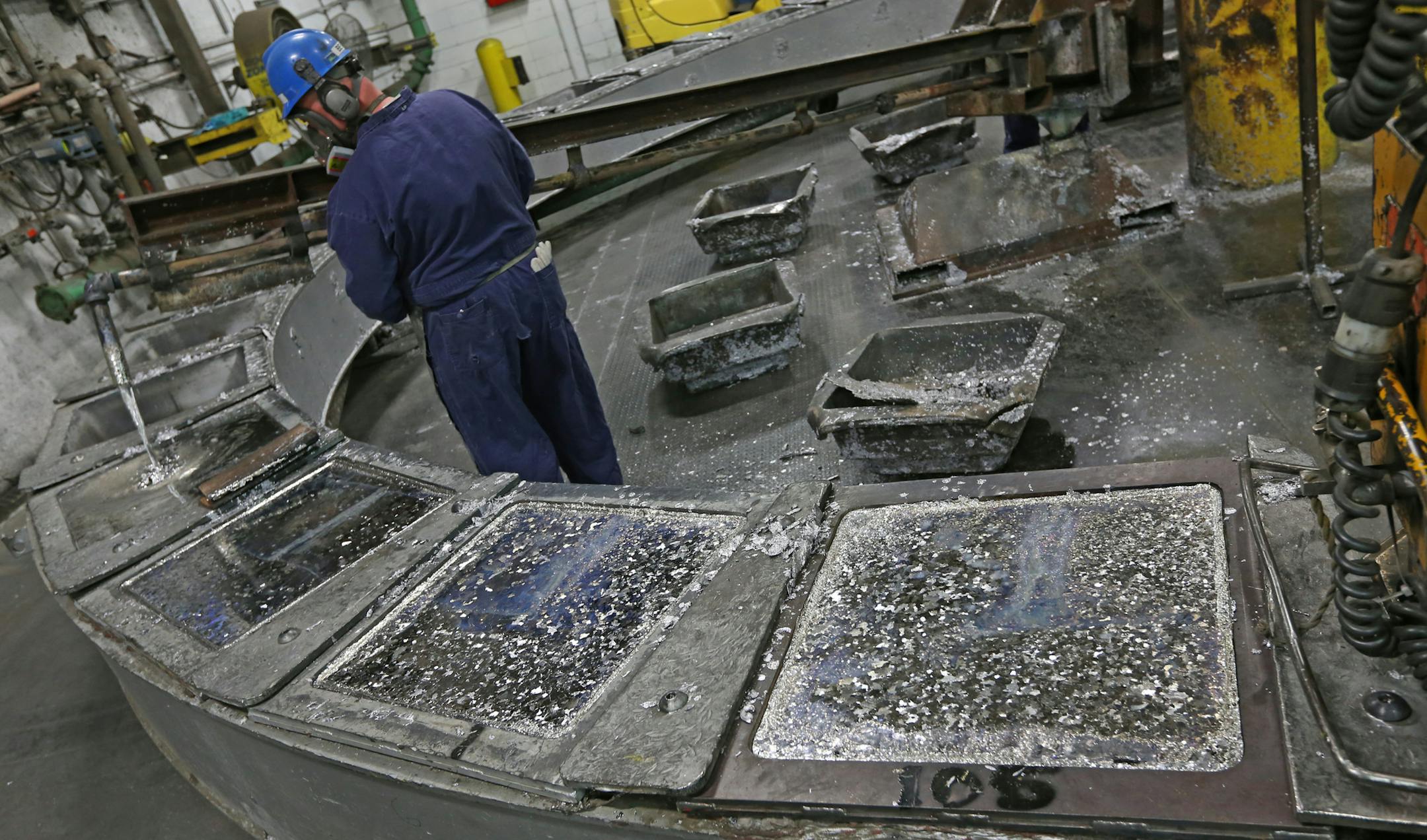 Gopher Resource employee Tracy Bennett poured melted lead from recycled batteries into ingots for reuse at the Eagan plant on 4/16/14. Eagan-based Gopher Resource recycles the lead and plastic out of millions of car/truck batteries a year (That equals 540 million pounds of lead and 30 million pounds of plastic each year.) Gopher Resource has plants in Eagan, MN. and Florida. The company added 72 workers last year in Minnesota, and just opened a Florida plant, and is increasing total production a