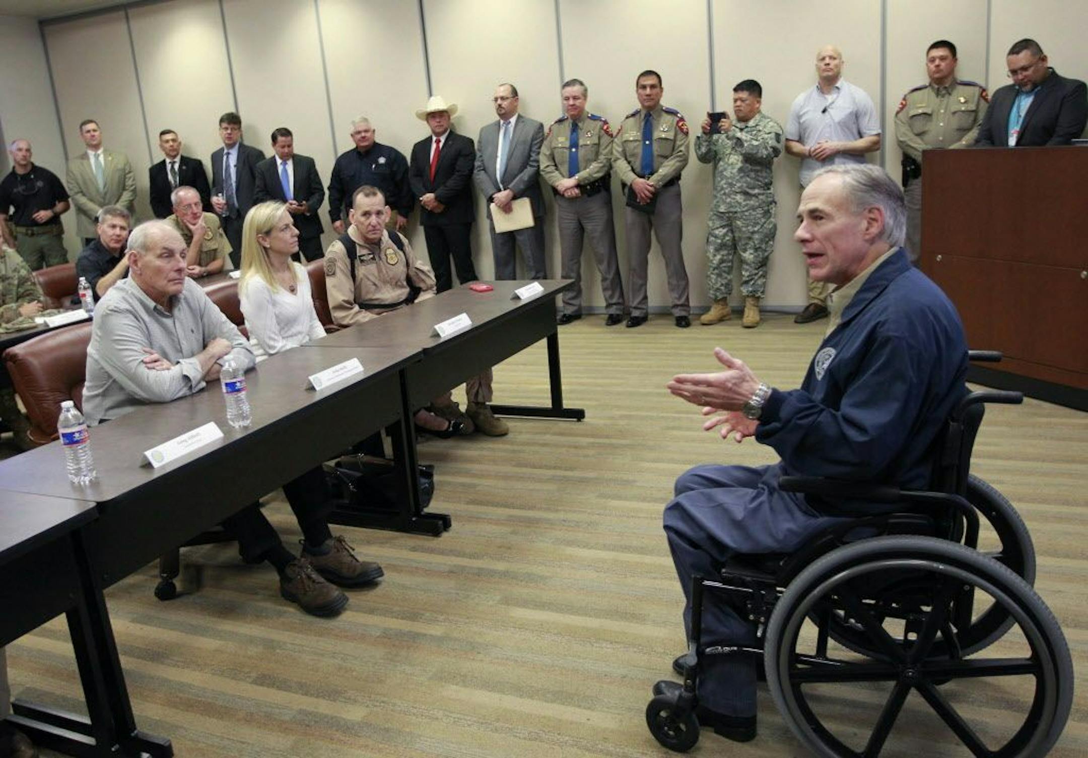 Gov. Greg Abbott, right, talks with Secretary of Homeland Security John Kelly, left, before a briefing on border security Wednesday Feb. 1, 2017 at the Texas Department of Public Safety regional headquarters in Weslaco, Texas. Secretary Kelly and Abbott toured the Texas border with Mexico in a helicopter following the briefing.