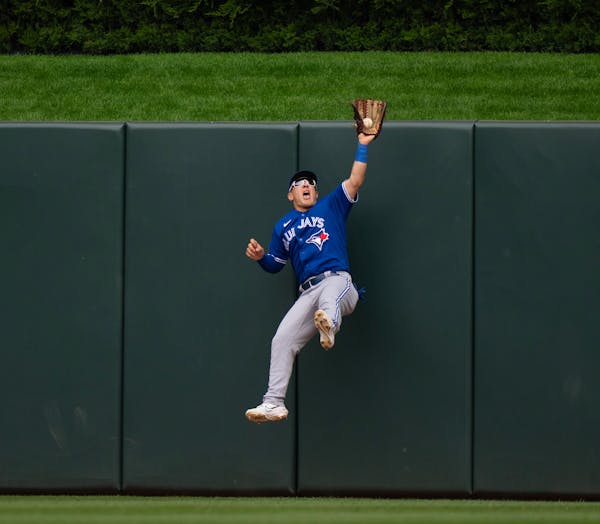 Minnesota Twins shortstop Carlos Correa went deep to center in the eighth inning, only to have the ball caught by Toronto Blue Jays center fielder Dau