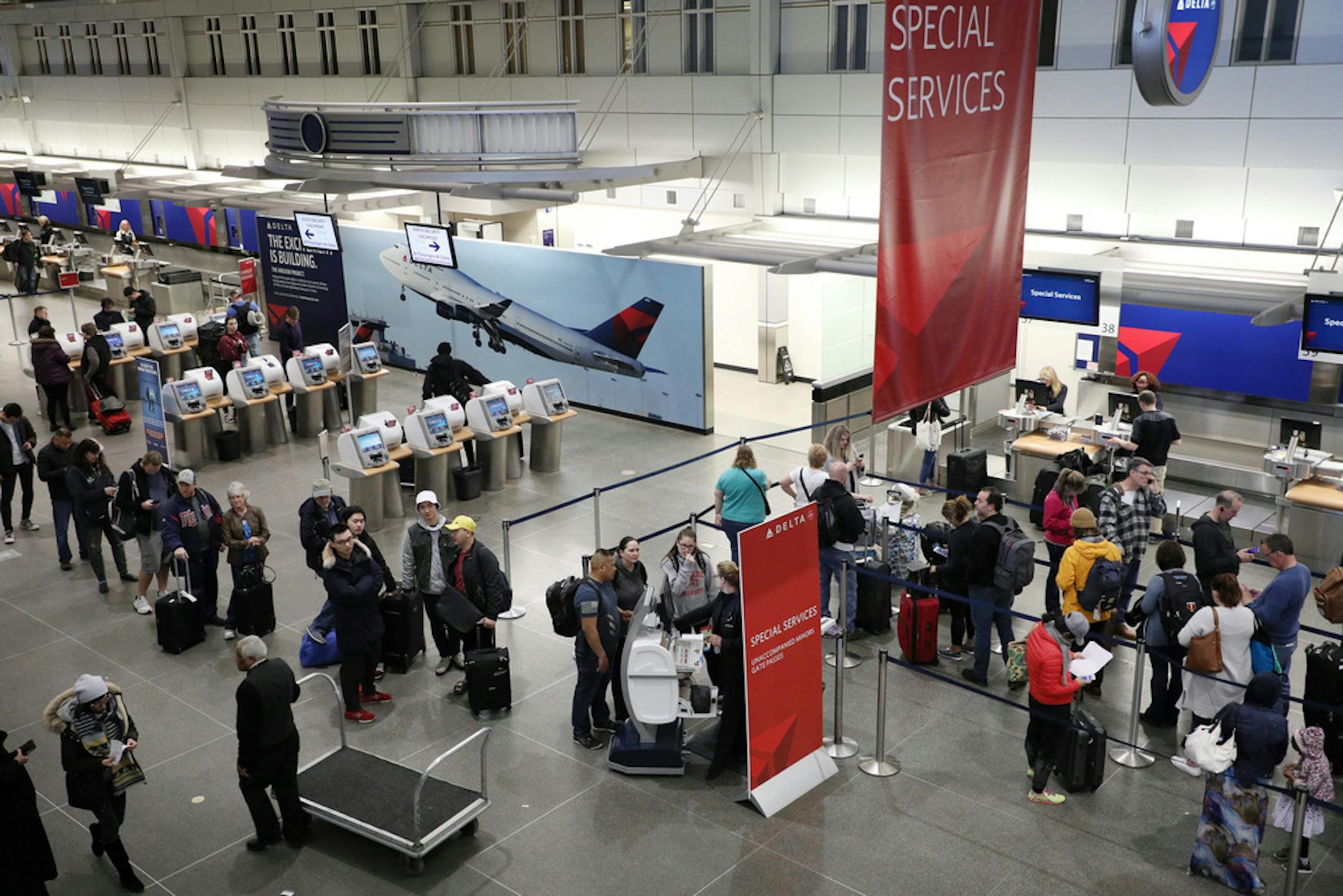 Passengers stood in Delta Air Lines' special services line at Minneapolis-St. Paul International Airport.