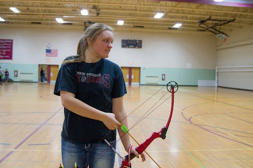 Callie Schroeder, a ninth-grader at New Prague High School, is the 2014 NASP (National Archery in the Schools Program) Minnesota state champion. Her score of 294 out of a possible 300, a personal best, was the highest among the more than 1,100 boys and girls grades 4-12 at the state tournament in Champlin in March. Photo by Mark Hvidsten