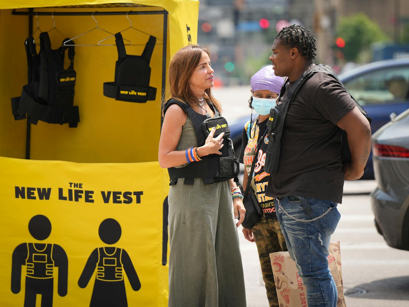 Patricia Oliver, whose 17-year-old son Joaquin, was killed in the Parkland shooting, talked with Jaudesemo Tajada at North Washington and Hennepin Avenues to raise awareness of how commonplace mass shootings have become Friday, June 9, 2023 Minneapolis, Minn. The parents of a victim killed in the Parkland, Florida shootings are spearheading an installation throughout Minneapolis Friday in which passersby are invited to try on a bulletproof vest, in an awareness effort that they say "spotlights the extreme — but sadly reasonable — idea of donning a bulletproof vest to go about our daily routines and activities, painting a serious picture about the realities living with near-daily mass shootings." Behind them is a woman named Cynthia who would not give her last name. ] GLEN STUBBE • glen.stubbe@startribune.com