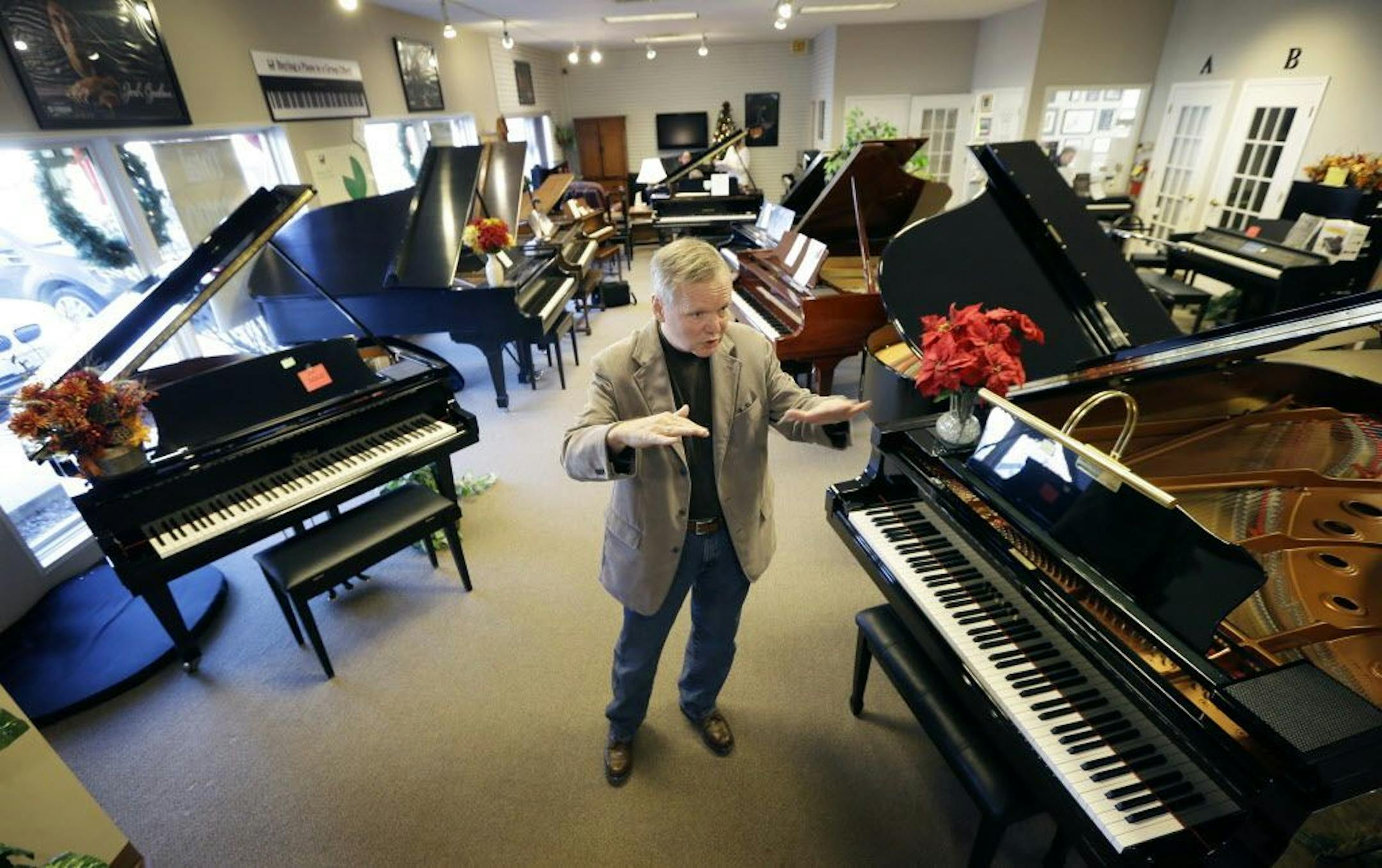 In this Dec. 3, 2014, photo, Jim Foster talks about his career at his Foster Family Music Center piano store, in Bettendorf, Iowa.
