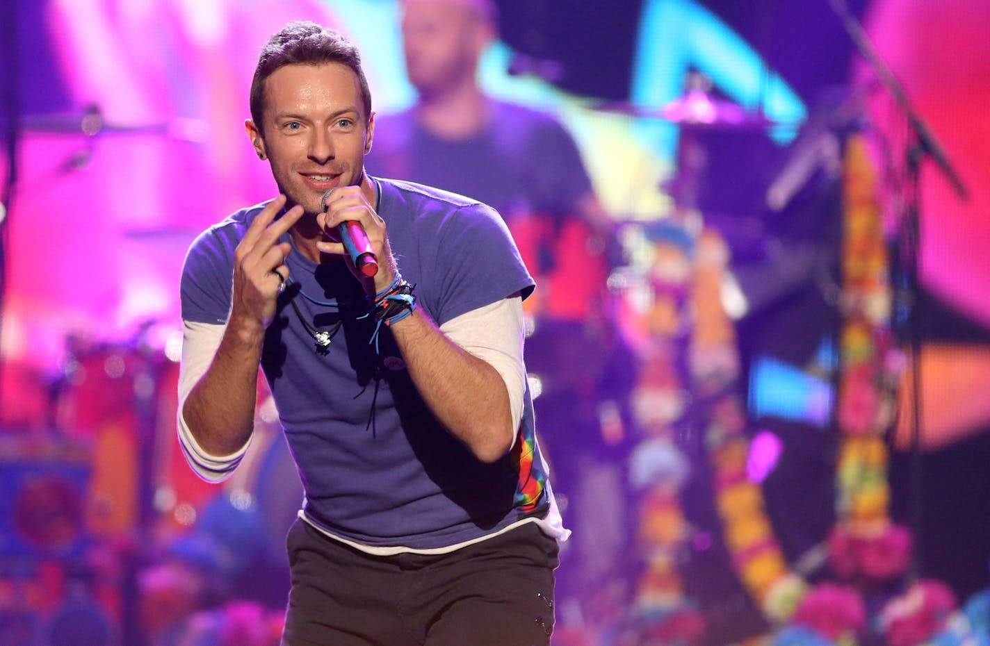 FILE - In this Sunday, Nov. 22, 2015 file photo, Chris Martin of Coldplay performs at the American Music Awards at the Microsoft Theater, in Los Angeles. Coldplay will perform at the Pepsi Super Bowl 50 Halftime Show on CBS Sunday, Feb. 7, 2016, the NFL announced on Thursday, Dec. 3, 2015. (Photo by Matt Sayles/Invision/AP, File)