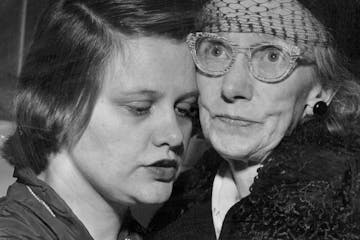 Laura Miller, left, and her mother, Dell Miller, visited at the McLeod County jail in Glencoe, Minn.