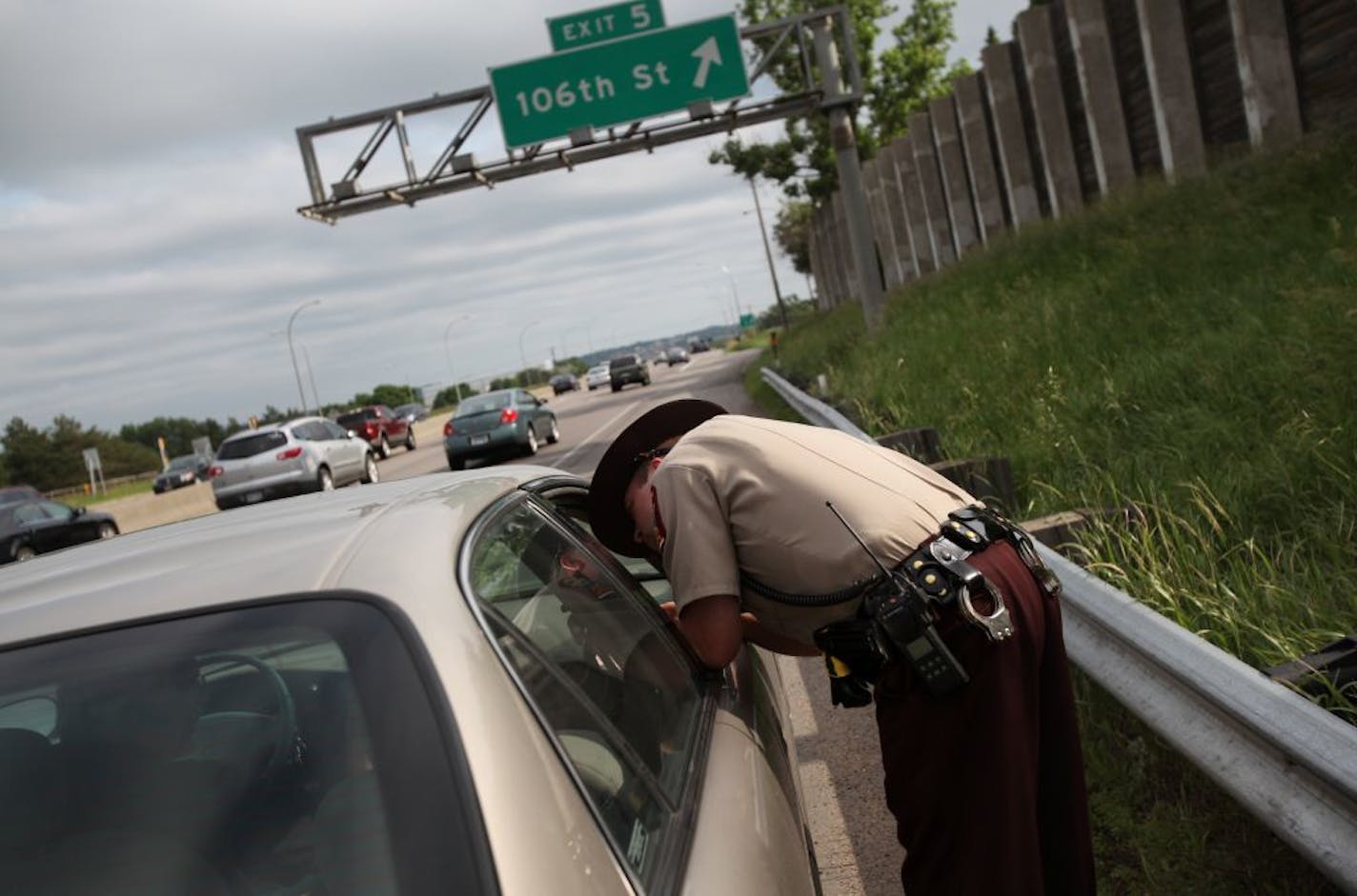 State trooper Kevin Kloss gave a man a ticket for driving in the carpool/MnPASS lane without a MnPASS or extra passengers during rush hour on southbound I-35W in Bloomington on June 20, 2011.