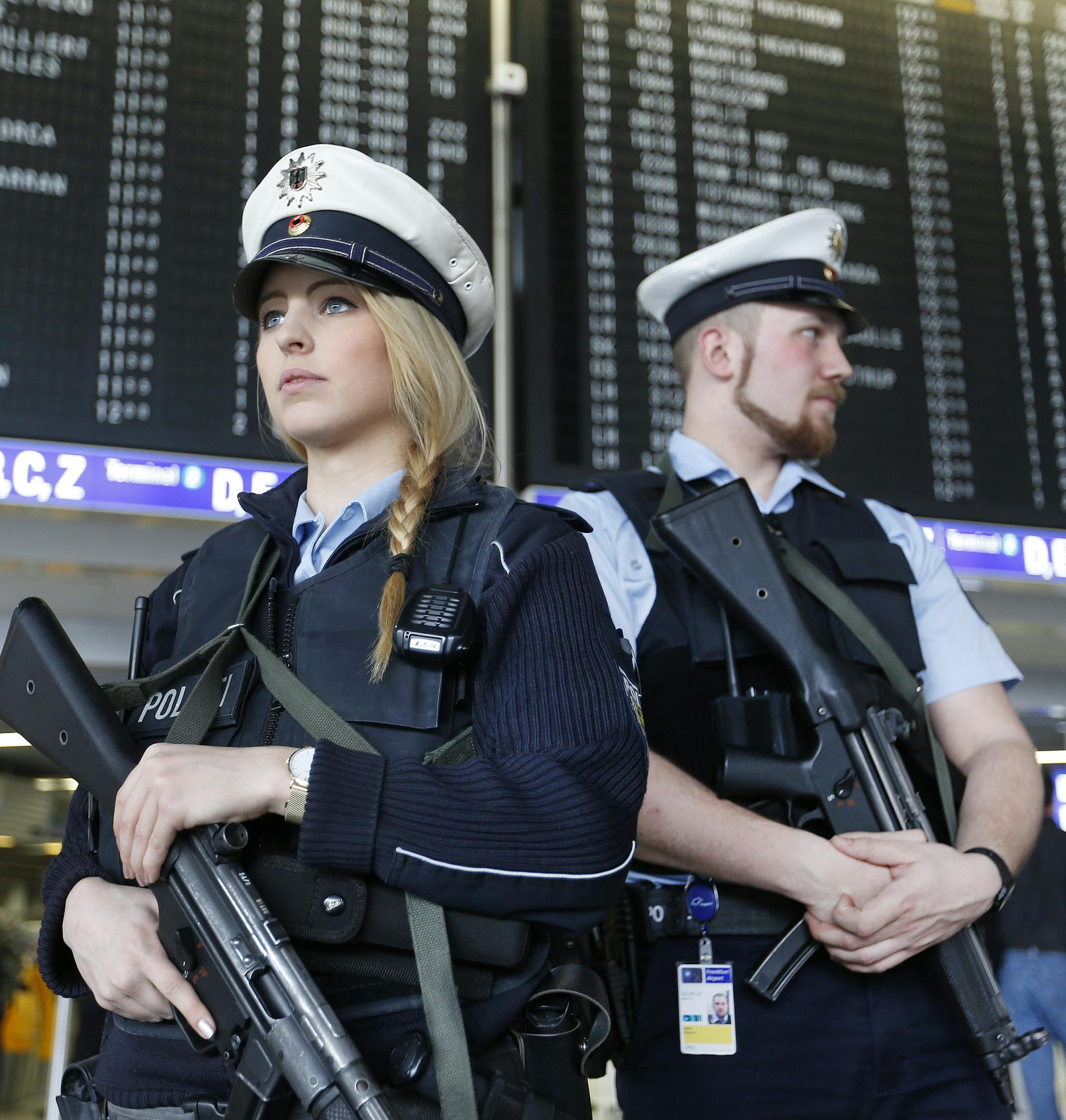 German police officers guard a terminal of the airportthe in Frankfurt, Germany, during tighter security measures Tuesday, March 22, 2016, when various explosions hit the the Belgian capital Brussels killing several people. (AP Photo/Michael Probst)