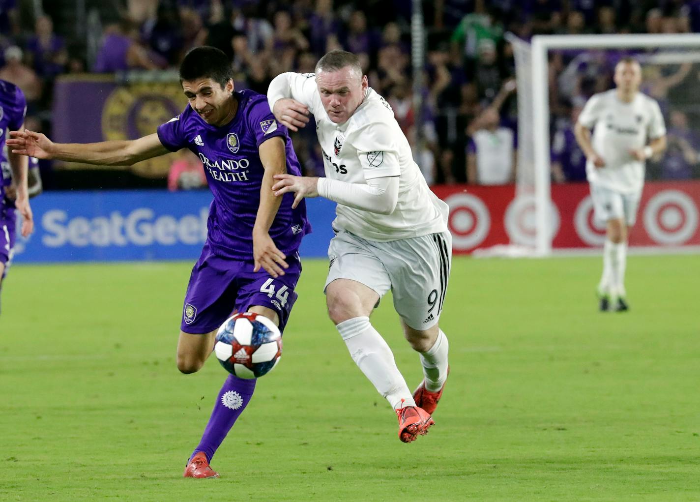 The presence of Wayne Rooney, right, benefits the MLS, it's said. Try convincing those checking him.