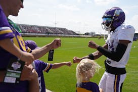 Vikings receiver Justin Jefferson greets fans as he takes the field at training camp last August.