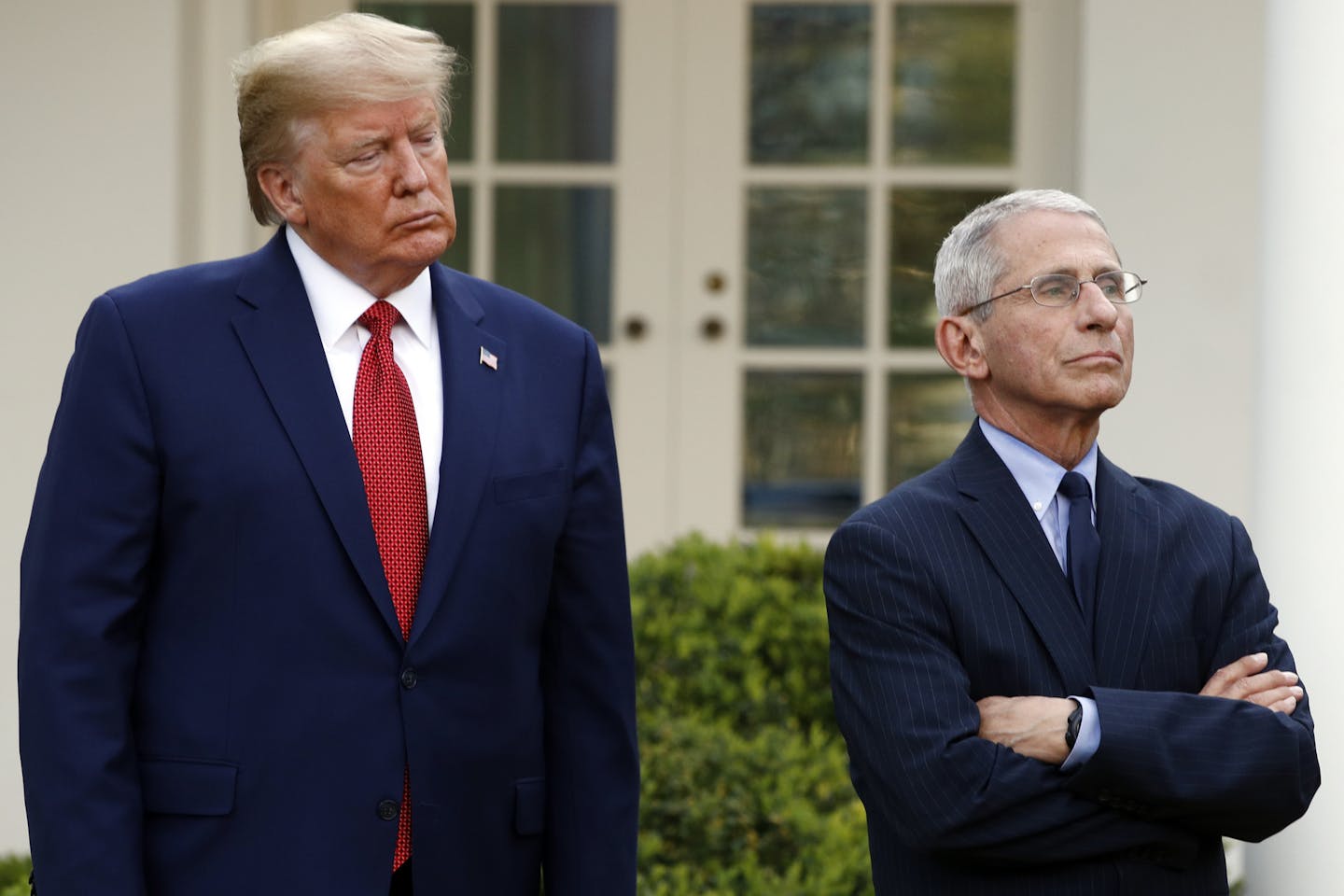 President Donald Trump and Dr. Anthony Fauci, director of the National Institute of Allergy and Infectious Diseases, listens as Dr. Deborah Birx, White House coronavirus response coordinator, speaks during a coronavirus task force briefing in the Rose Garden of the White House, Sunday, March 29, 2020, in Washington.