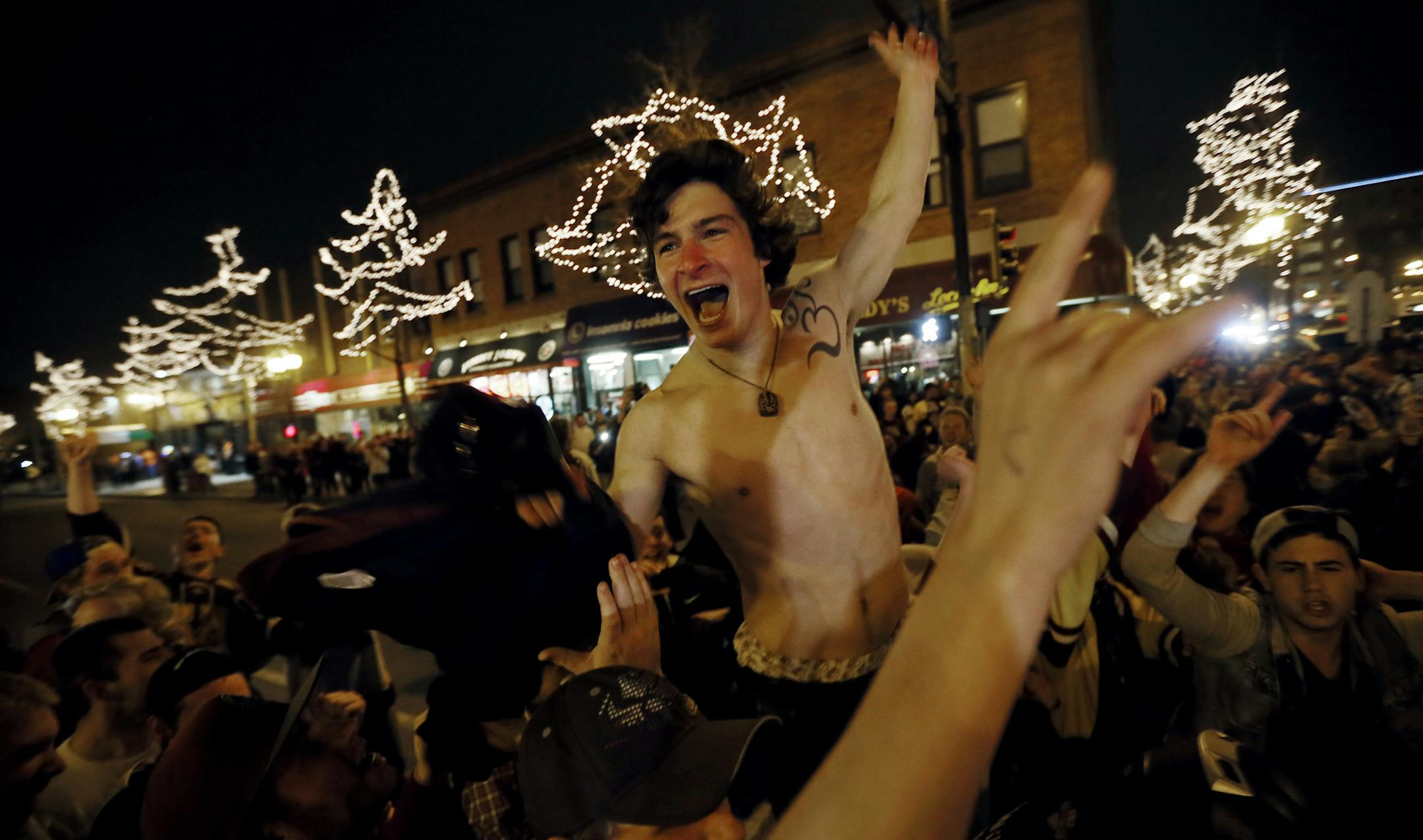 University of Minnesota students refuse to clear the streets in Dinky town after the Gophers lost to Union Saturday April 12, 2014 in Minneapolis , MN. ]JERRY HOLT jerry.holt@startribune.com