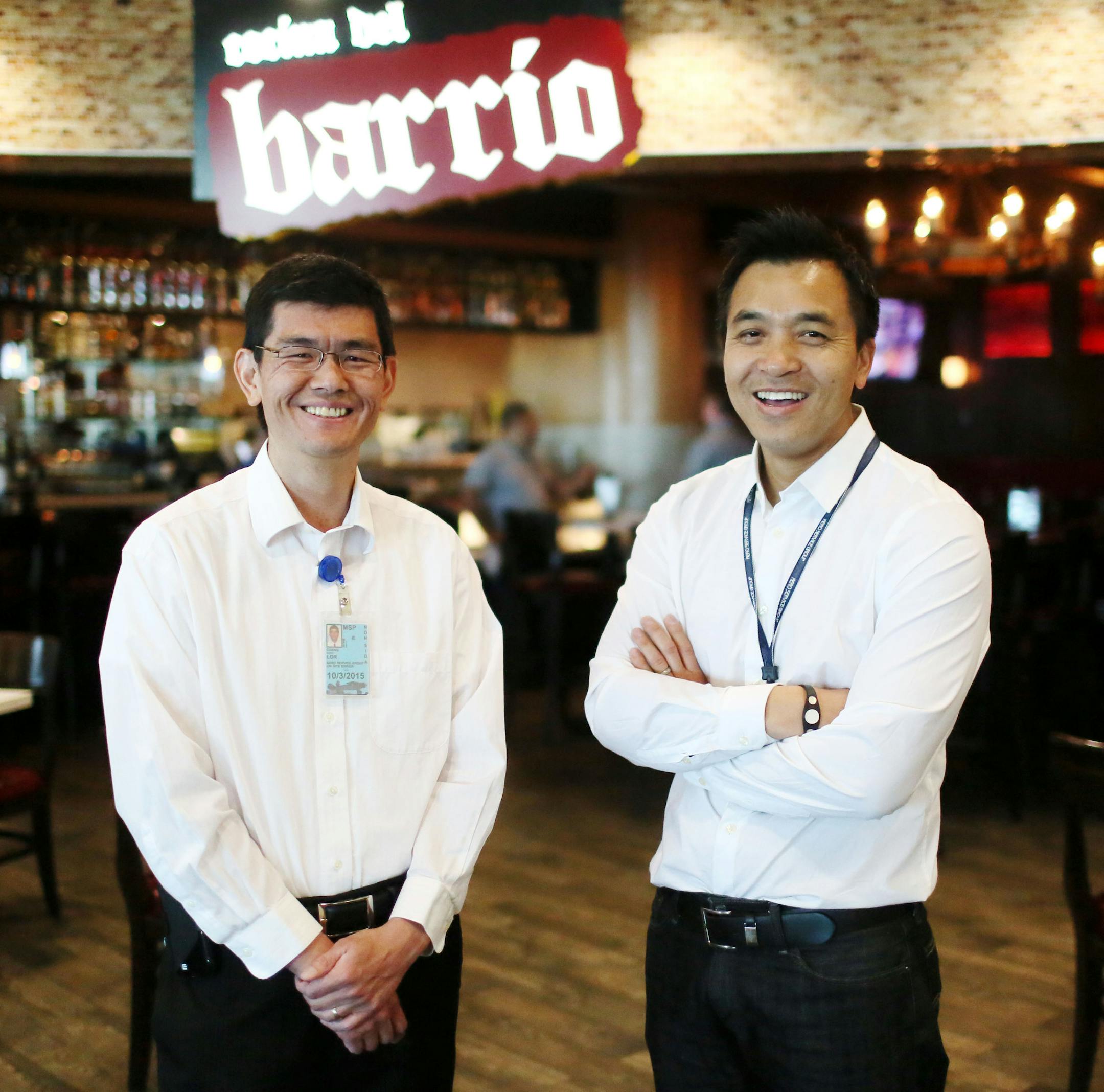 Cheng Lor, left, and his family fled the killing fields of Cambodia; Binh Le's family escaped South Vietnam as Saigon fell. The now friends and business partners were seen at their Cocina Del Barrio venture at the Humphrey Terminal at MSP Wednesday, April 22, 2015 in Minneapolis, MN.](DAVID JOLES/STARTRIBUNE)djoles@startribune.com Cheng Lor and his family fled the killing fields of Cambodia; Binh Le's family escaped South Vietnam as Saigon fell. The two men started a business running airport res