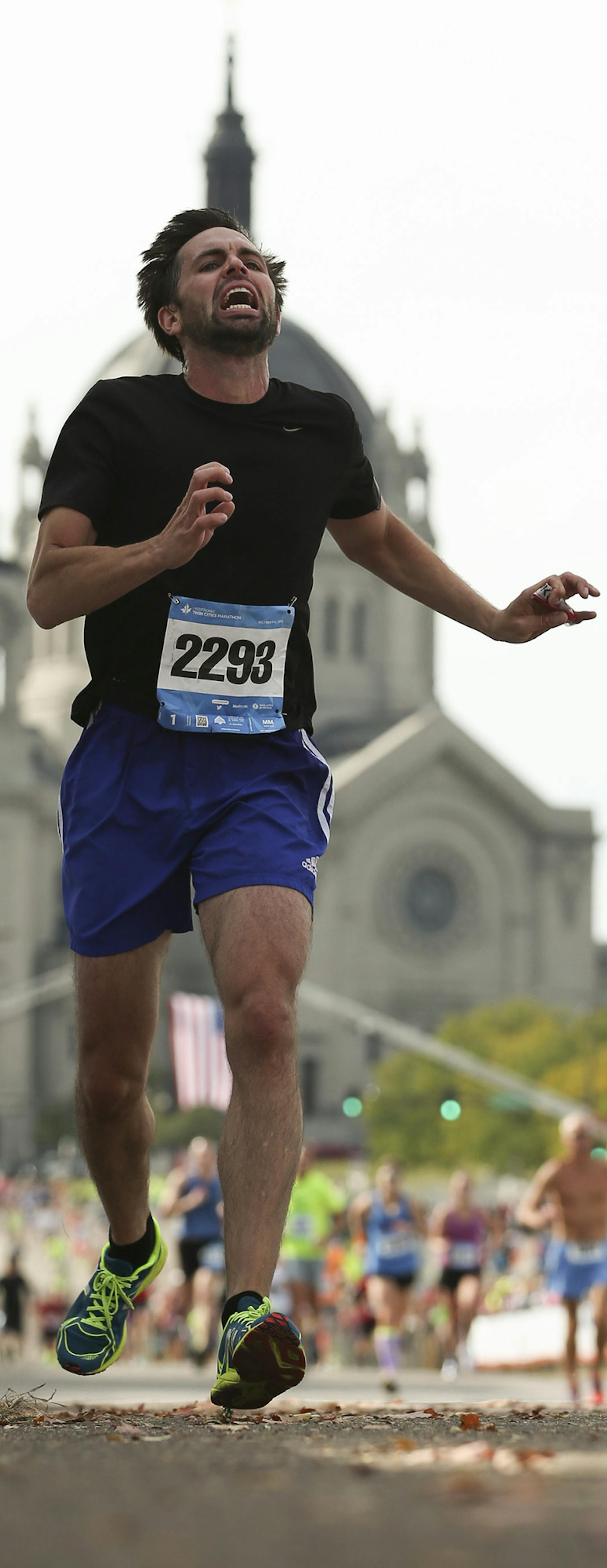Runners, including Joe Giant of Minneapolis, wearing bib 22935, approached the finish line Sunday morning. ] JEFF WHEELER • jeff.wheeler@startribune.com More than 11,000 runners started the Twin Cities Marathon Sunday morning, October 4, 2015 in Minneapolis.