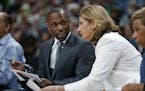 Lynx Head Coach Cheryl Reeve listened to former assistant coach James Wade during a game.