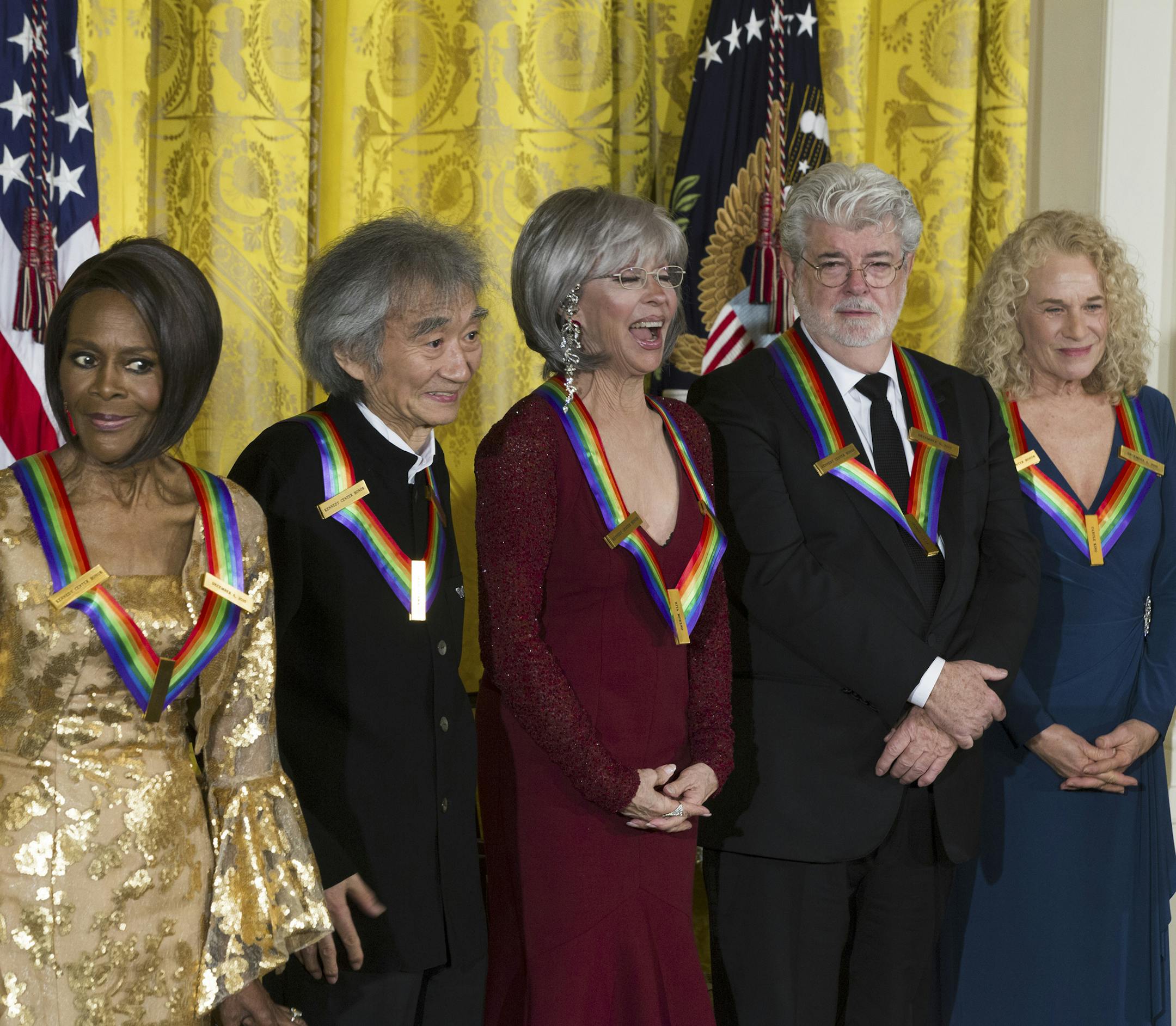 Kennedy Center honorees, from left: Cicely Tyson, Seiji Ozawa, Rita Moreno, George Lucas and Carole King during a reception hosted by President Obama and first Lady Michelle Obama in the East Room of the White House, Dec. 6, 2015. The honorees will attend a Kennedy Center Honors program later in the evening, for which the president canceled his attendance due to his planned address to the nation about terrorism. (Doug Mills/The New York Times)