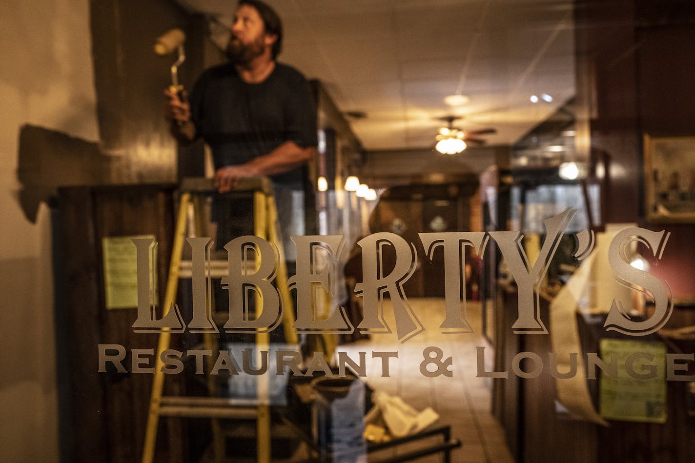 Doug Noreen, owner of the Liberty's Restaurant in downtown Red Wing, put a fresh coat on the east wall of the restaurant on Tuesday, Sept. 29. That's the site where a vehicle hit the building.