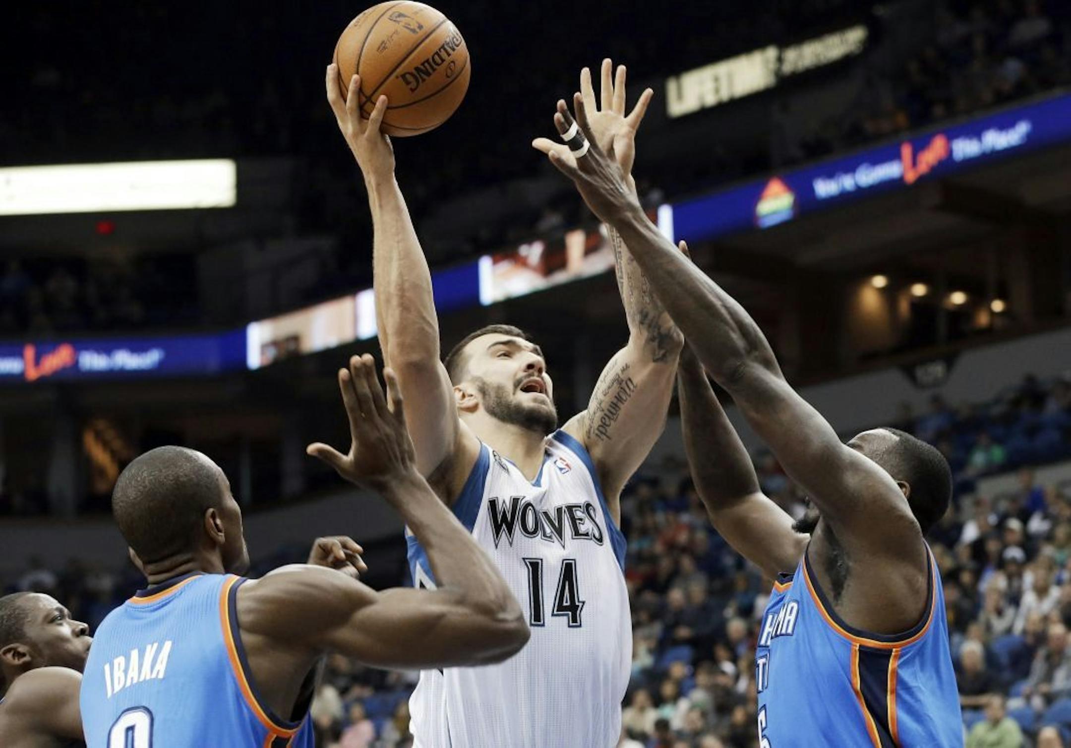 Minnesota Timberwolves' Nikola Pekovic, center, of Montenegro, shoots during Friday's victory over Oklahoma City.