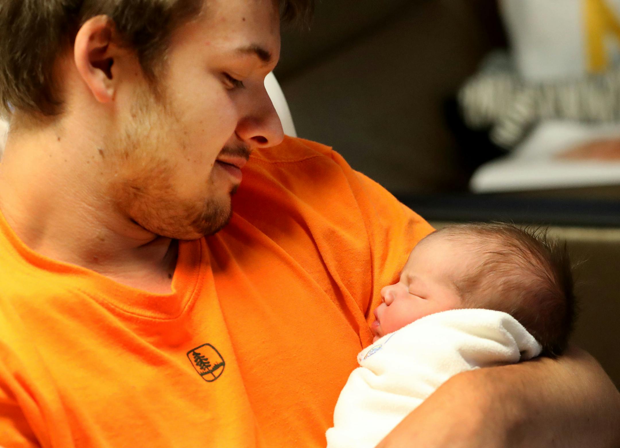 Former Boy Scout Jacob Schindler, 23, took the scout motto to heart. Included in the 200 some odd books he reads yearly, Schindler read books on how a baby is born. This July 4th, that preparation paid off for Schindler, who delivered his baby daughter Griffon Elizabeth in the back seat of the family car when mother, Abby Vanyo, 22, went into labor en route to the hospital, on I-94 E, near the the Broadway Avenue exit. The family was seen in Vanyo and baby Griffon's room at Abbott Northwestern H