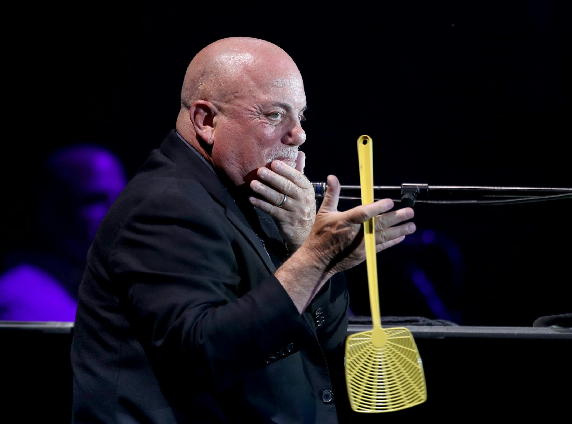 Between songs Billy Joel twirled a fly swatter while talking to the audience during his performance Friday, July 28, 2017, at Target Field in Minneapolis, MN.