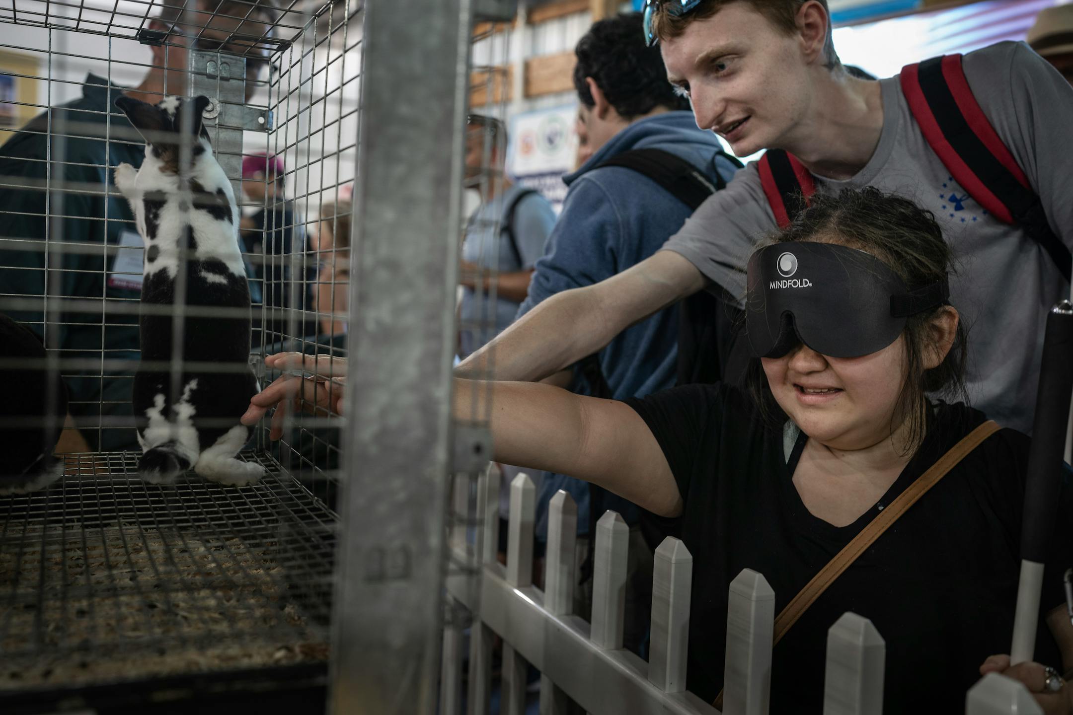Isabellah Khang left, and Dillion Kuester touch a bunny at the Miracle of Birth Center.