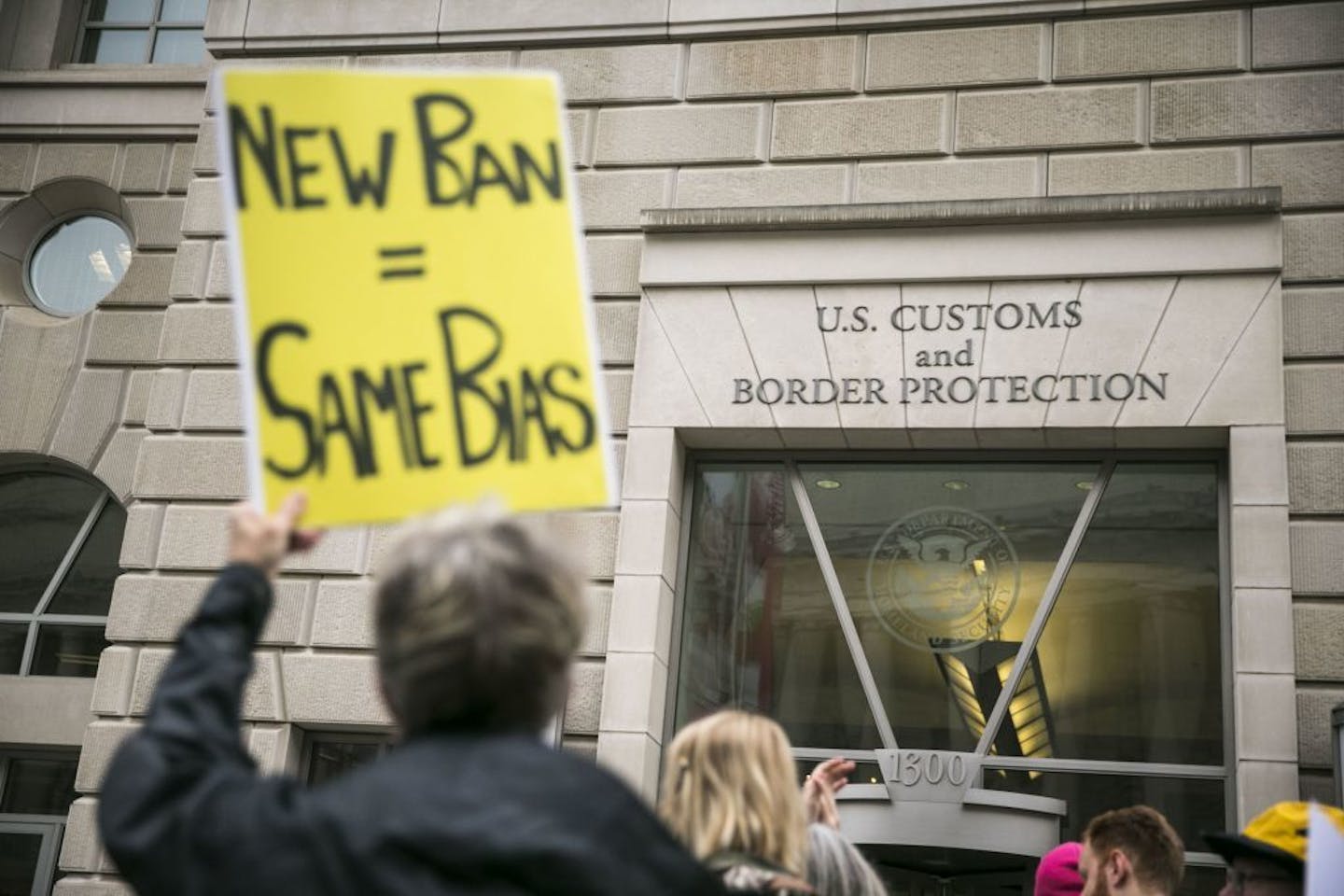 Protesters demonstrate against President Donald Trump.s revised travel ban, outside the U.S. Customs and Border Protection headquarters in Washington in March. A federal appeals court in Richmond, Va., refused to reinstate the ban Thursday.