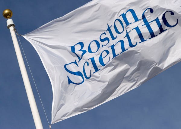 The company flag flies in front of Boston Scientific Headquarters in Natick, Massachusetts Thursday, January 12, 2006. Guidant Corp., after accepting 