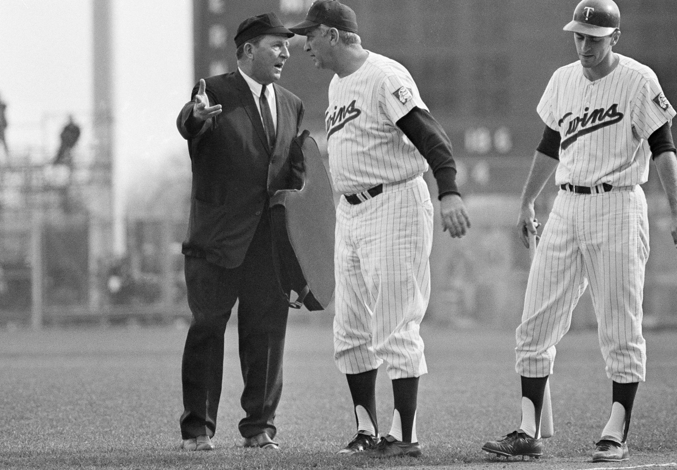 Home plate Umpire Ed Hurley and Minnesota Twins Manager Sam Mele argue over an interference call on Joe Nossek in third inning in Minneapolis on Oct. 14, 1965. Hurley called Nossek out for interfering with Dodgers catcher John Roseboro?s throw to second when Twins shortstop Zoilo Versalles attempted to steal. (AP Photo) ORG XMIT: APHS167281
