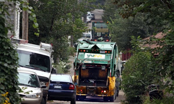 Sept. 25, 2009 - St. Paul, MN; Trash haulers wind their way through an alley in the Mac-Groveland neighborhood Friday morning.