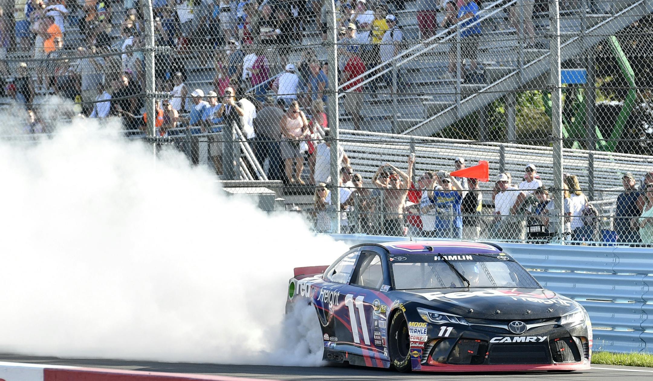 Denny Hamlin sent the smoke flying Sunday after winning at Watkins Glen.