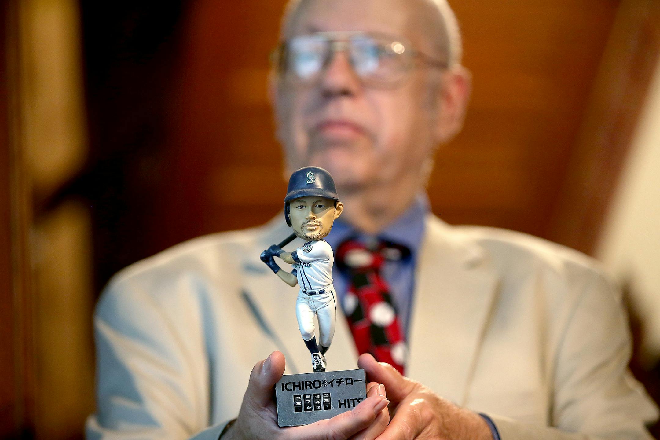Seth Hawkins ('Dr. Fan' as he calls himself) held his favorite bobblehead of Ichiro Suzuki.