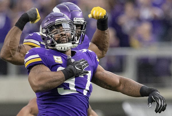 Minnesota Vikings Everson Griffen and Danielle Hunter celebrate a sack in the third quarter against the Detroit Lions