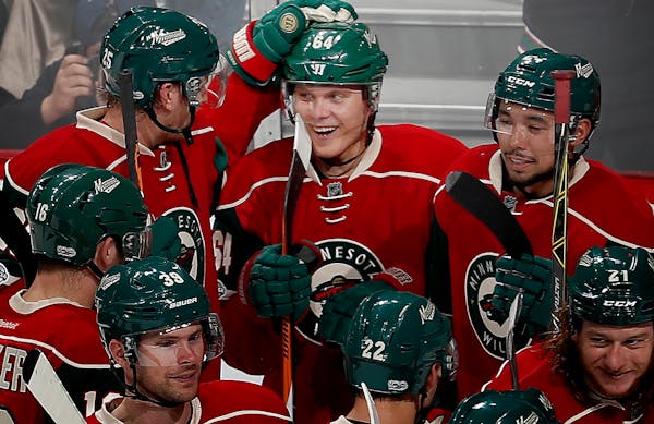 Mikael Granlund (64) celebrated with teammates after scoring the game winning goal in overtime. ] CARLOS GONZALEZ • cgonzalez@startribune.com - Febr