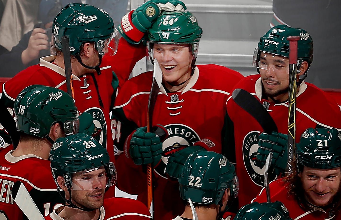 Mikael Granlund (64) celebrated with teammates after scoring the game winning goal in overtime. ] CARLOS GONZALEZ • cgonzalez@startribune.com - February 27, 2017, St. Paul, MN, Xcel Energy Center, NHL, Hockey, Los Angeles Kings at Minnesota Wild