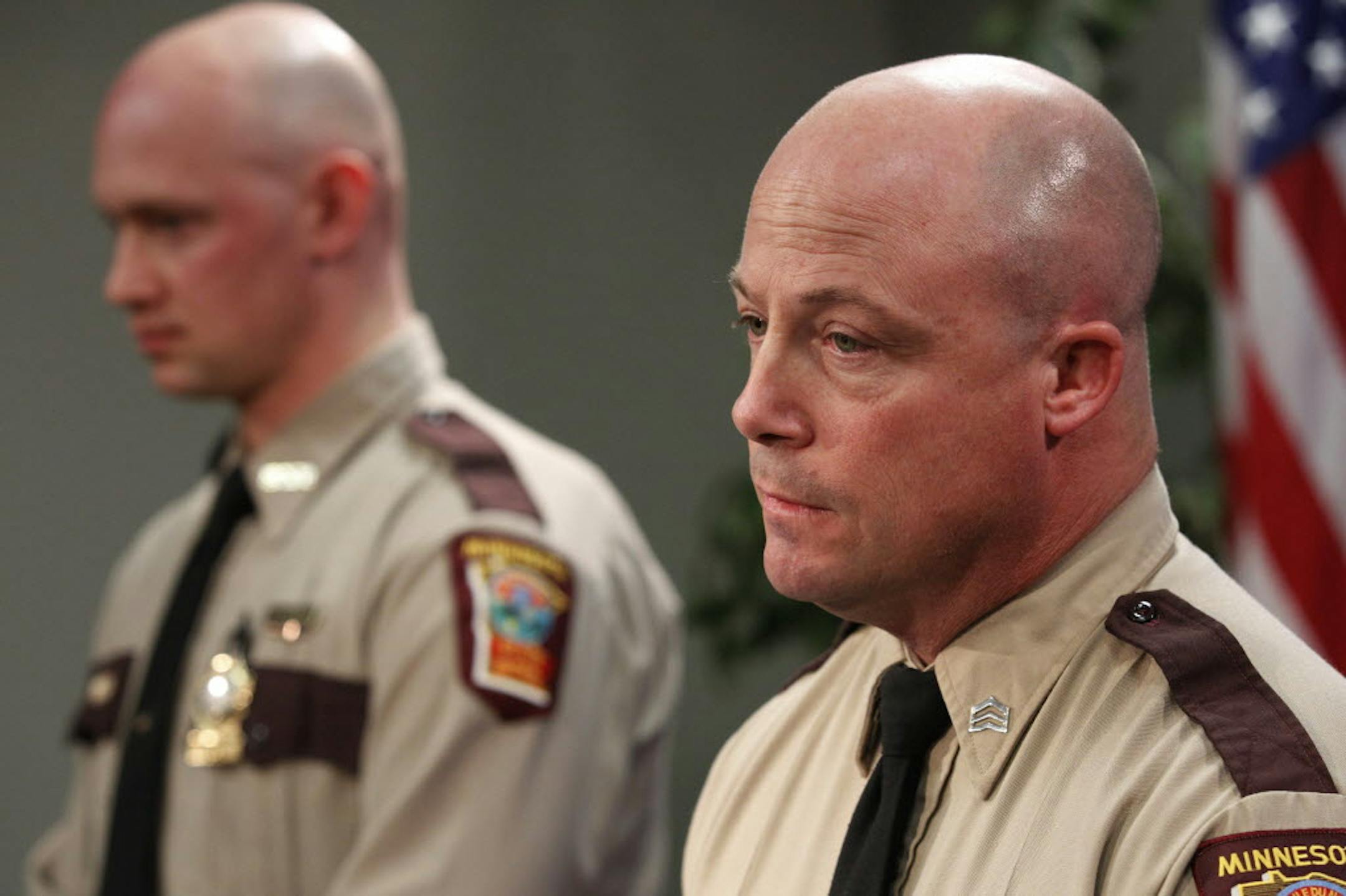 State trooper Andy DeRungs, left at top, and Sgt. Dan Lewis, spoke Wednesday about the need for motorists to be more aware of patrol cars stopped on highway shoulders.